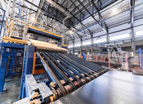 Modern operational plant equipment assembly line producing fiberglass batt heavy industry machinery metalworking workshop concept.